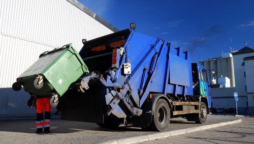 Demolition site with waste materials being removed