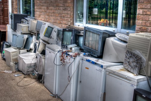 Workers implementing waste reduction strategies