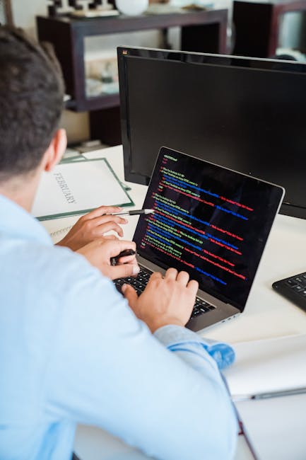 A close-up view of a computer screen displaying lines of HTML code in a text editor. The code includes tags such as <html>, <head>, and <body>, with various attributes and content su